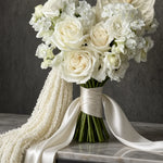 Close-up of white roses, anthurium and trailing amaranthus in a cascading bridal bouquet — IFIORA, Warsaw (Mokotów)