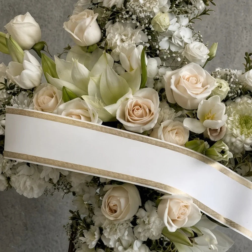 Close-up of white chrysanthemums, roses and lilies in a funeral cross — IFIORA florist, Warsaw (Mokotów)