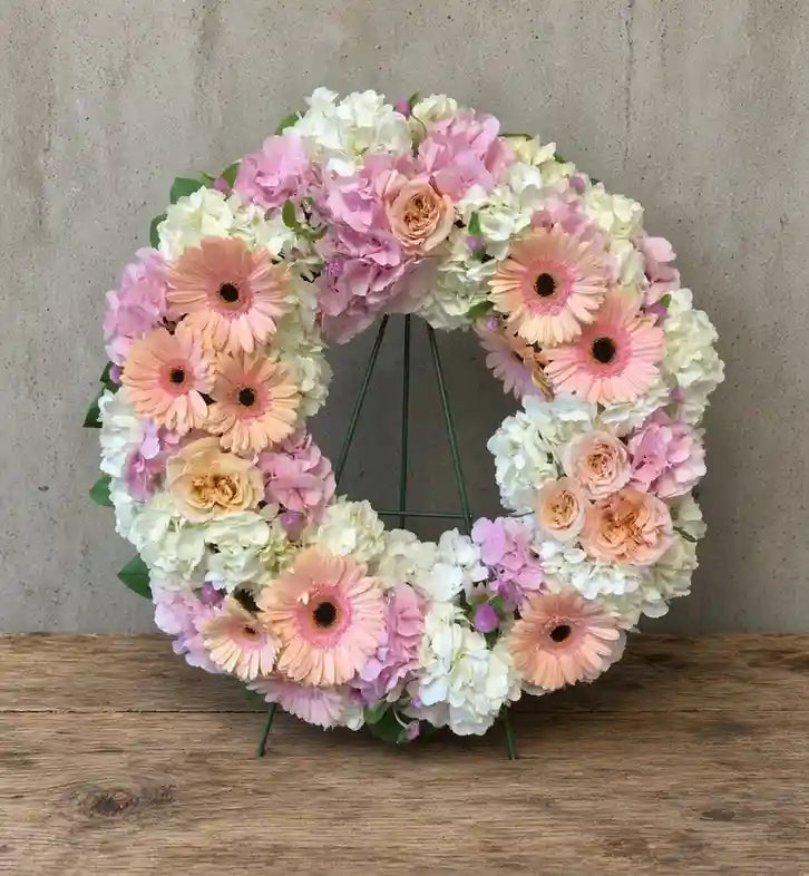 Pastel wreath with white and pink hydrangea, peach gerberas and garden roses, XL arrangement shown as a reference